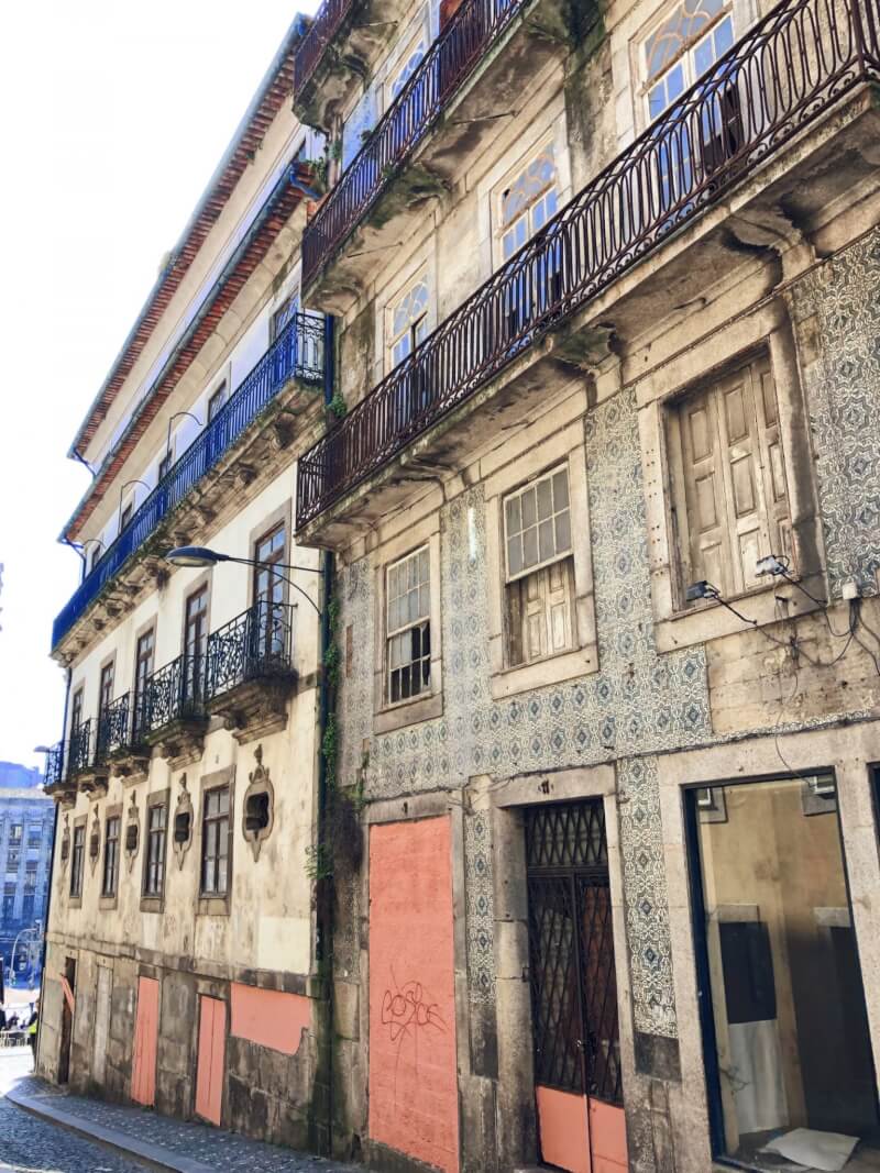 Admiring the crumbling architecture in Porto