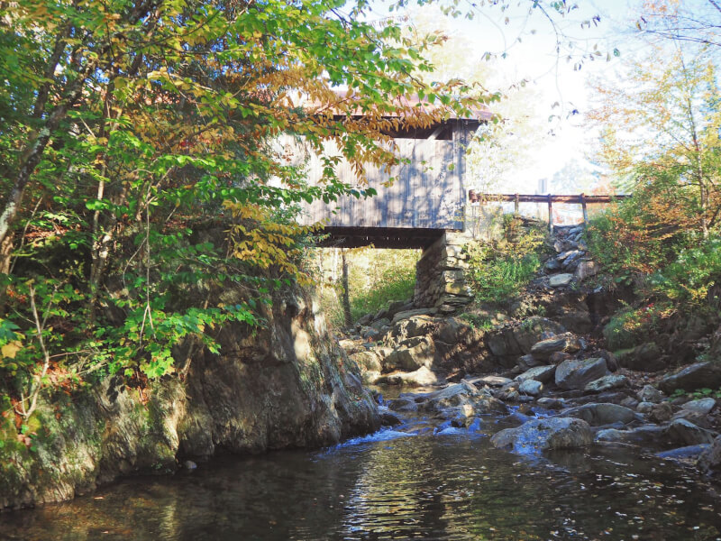 image of covered bridge in Vermont which is Gold Brook bridge in Stowe