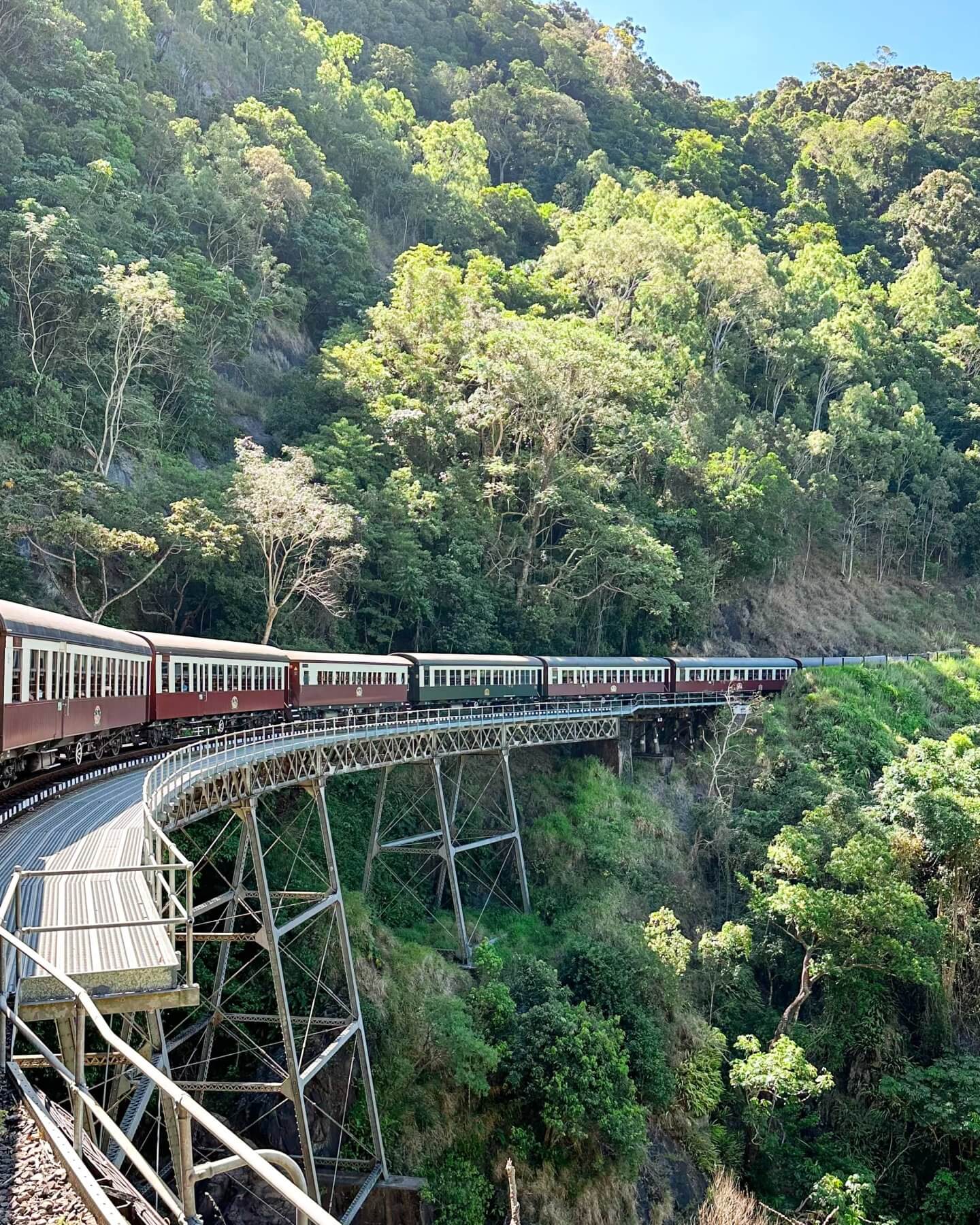 image of the Kuranda Scenic Rail on a bridge built on the edge of a mountain