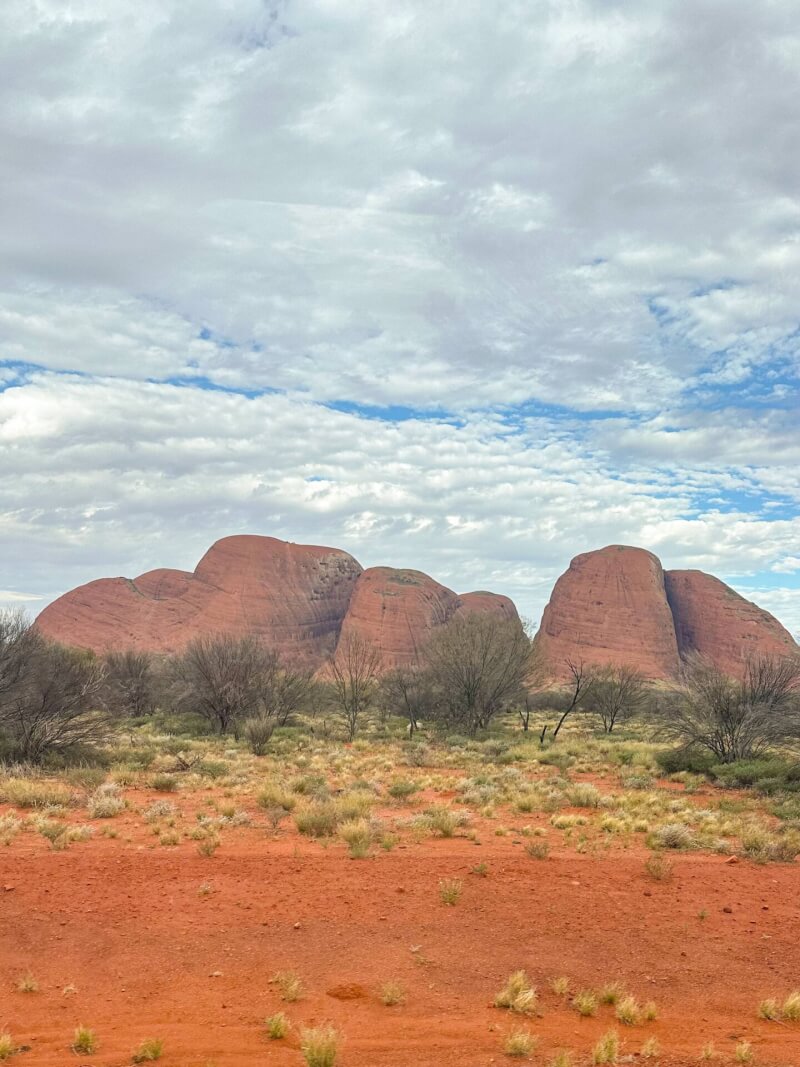 image of the rock formation domes of Kata Tjuta, with the red outback desert in the foreground
