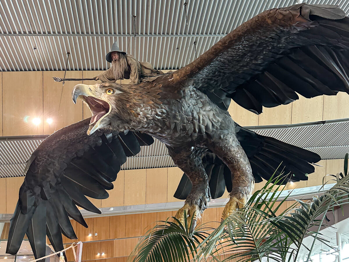 A massive sculpture of Gandalf the Grey riding a Great Eagle, suspended from the ceiling at Wellington International Airport. This Middle-earth installation is a fantastic first stop for travellers deciding what to do in Wellington upon arrival.