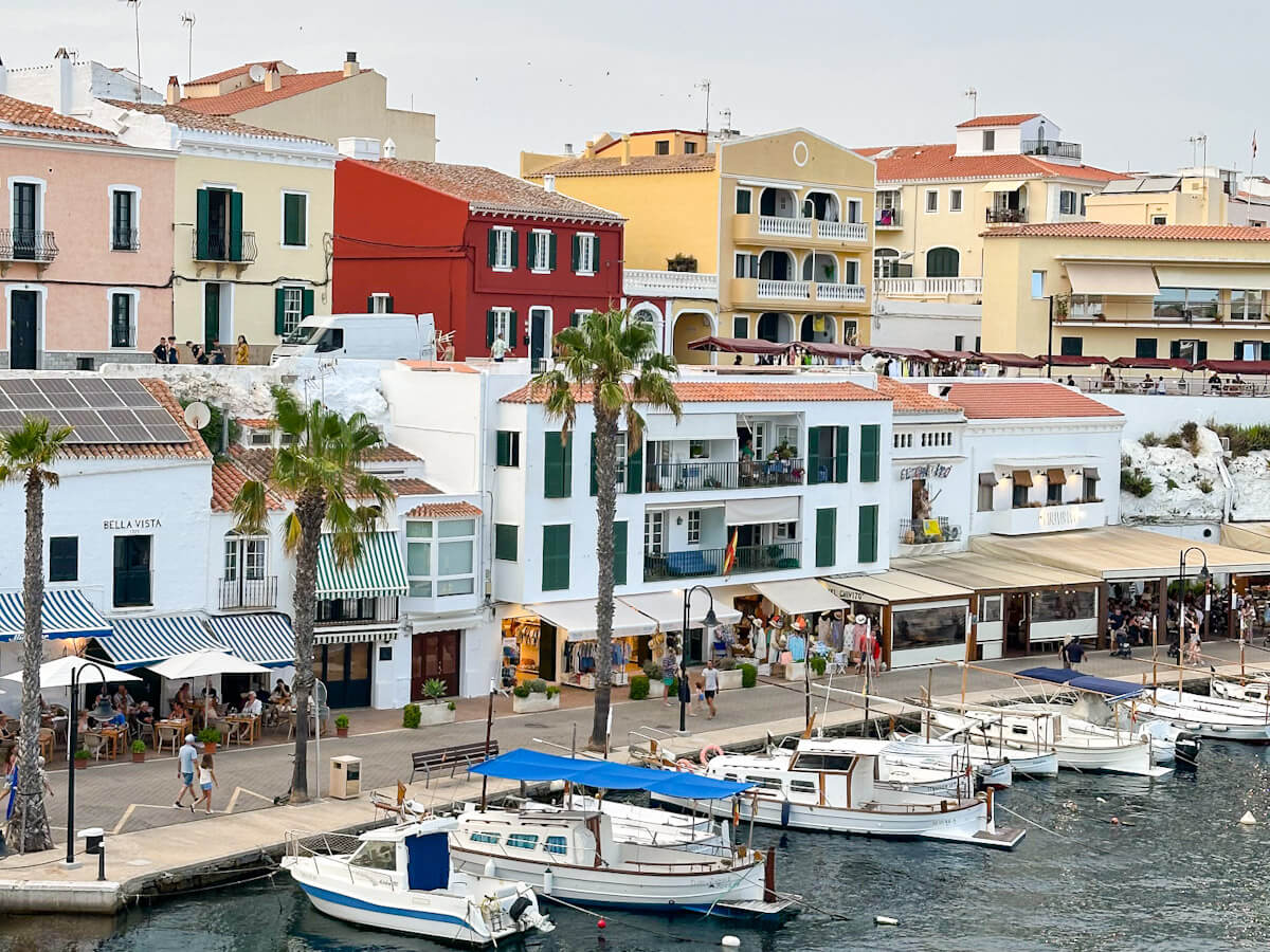Colourful buildings and boats docked at the harbour in Es Castell during a trip to Menorca in October.