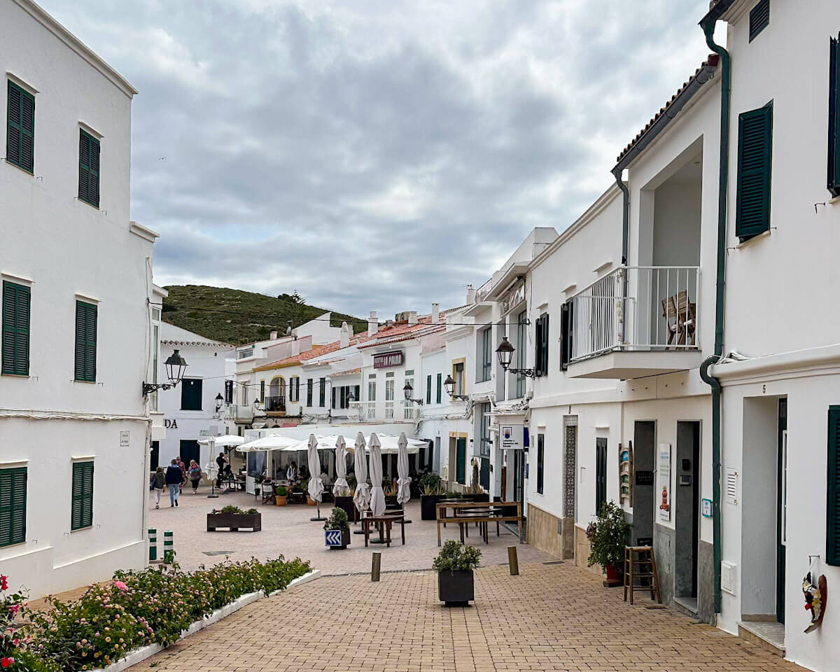 Walking down the quiet white-washed streets of Fornells village when visiting Menorca in October.